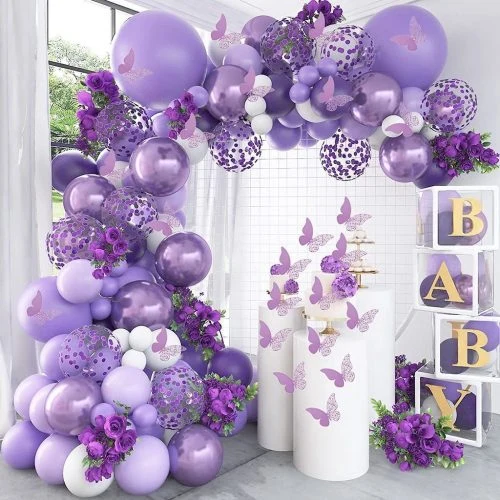 A purple balloon and floral setting for a baby shower