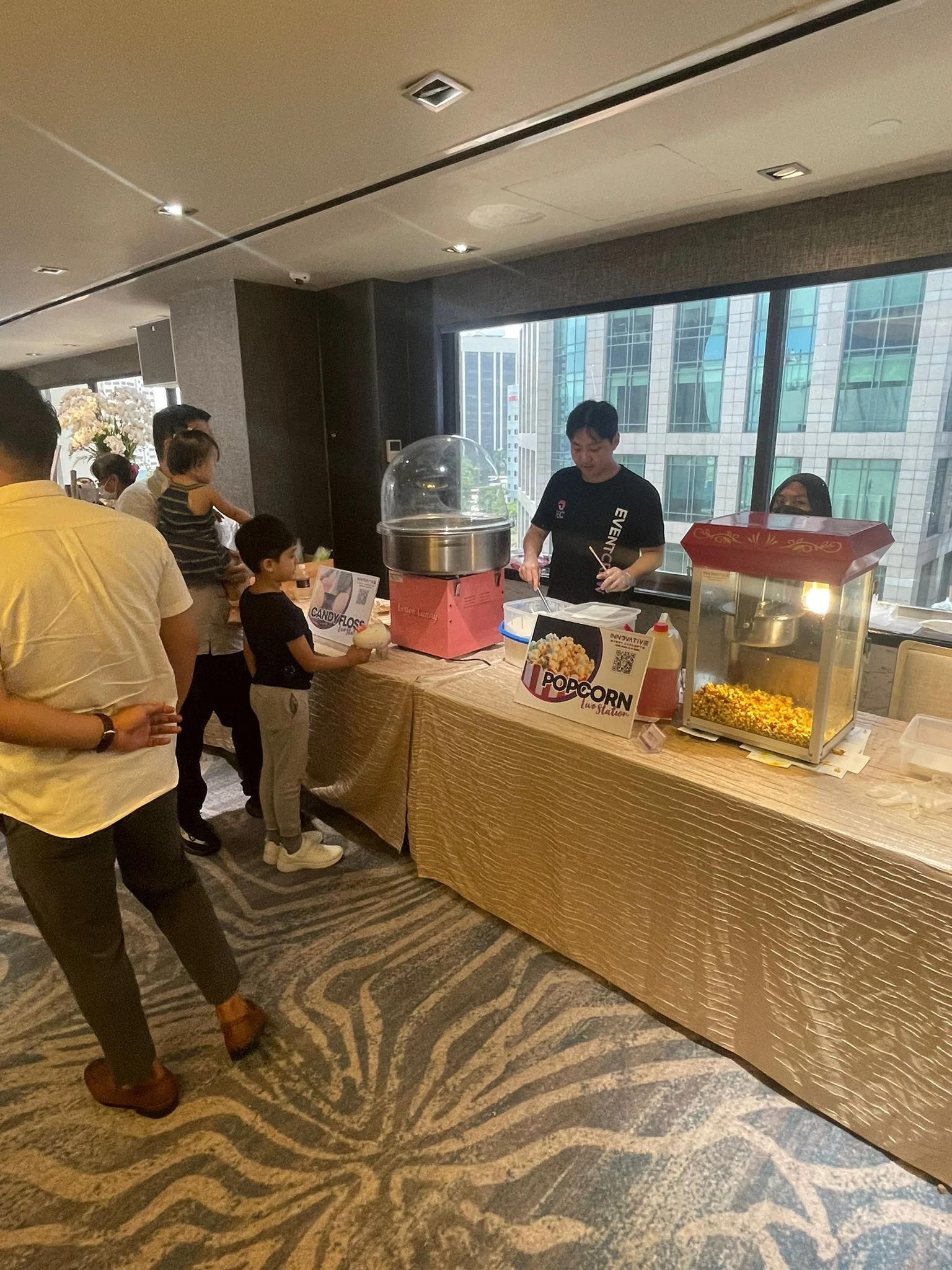 Food live stations at an indoor occasion